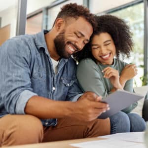 couple happily going over finances